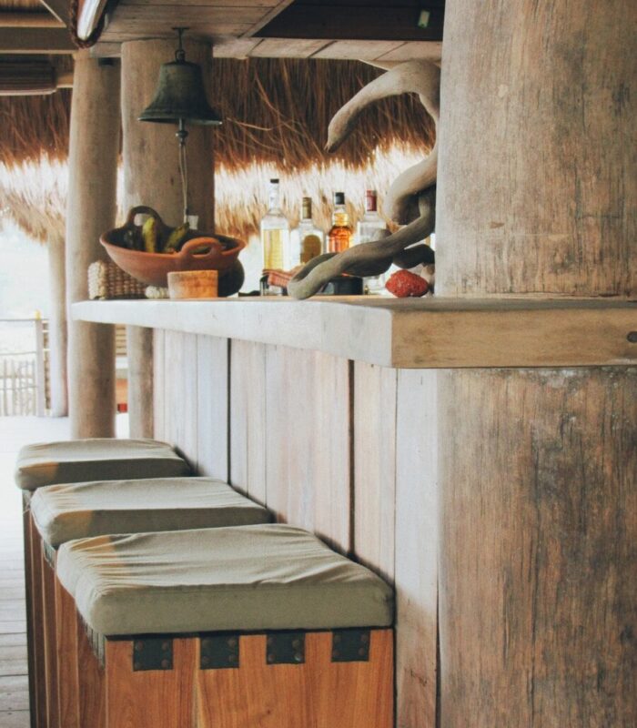 a kitchen with a shelf and a table with a basket and a basket